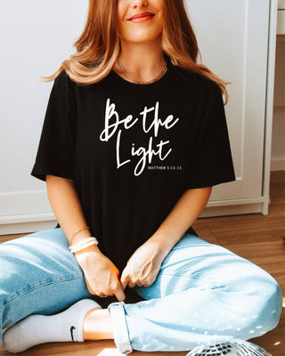 Be The Light on Black Bella Graphic Tee